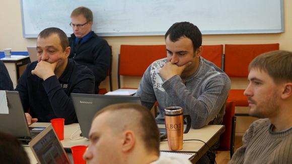 Yuriy from Mykolaev (left) and Denis from Crimea (center/right) focus on classwork despite recent upheaval in Ukraine.