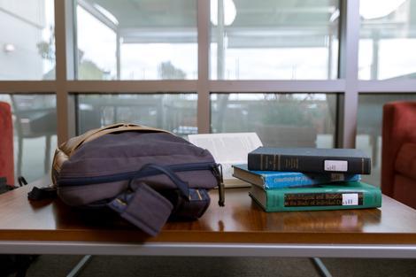 backpack and books on table