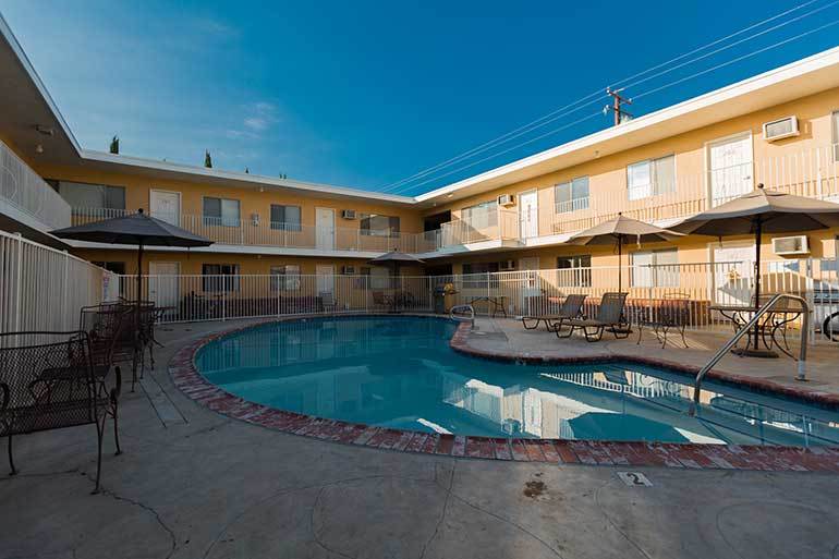 Tropicana courtyard with swimming pool and picnic tables