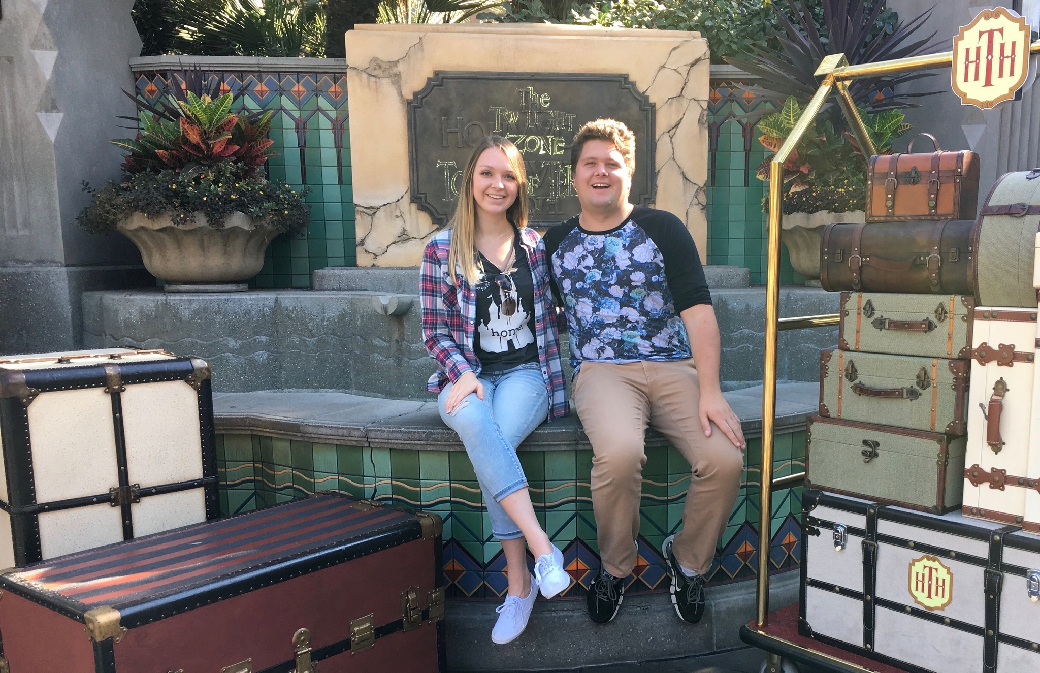 Jessica and brother posing by the Hollywood Tower Hotel at Disneyland