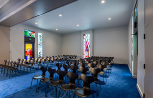 Southern wing of Calvary Chapel with stained glass focused on the crucifixion