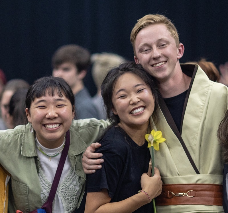 Kristen, her sister Annie, and Annie's boyfriend Kaiden; Annie and Kaiden are dressed in robes like Jedis from Star Wars