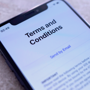 A smartphone screen displays an app's Terms and Conditions page.