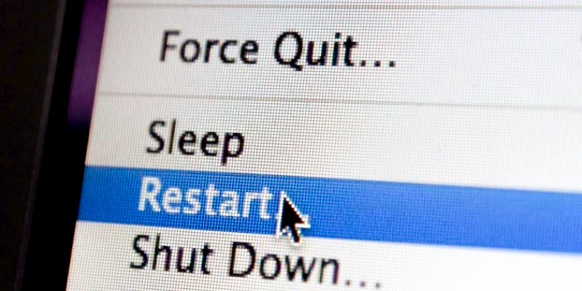 A mouse arrow highlights the Restart option on a computer screen.