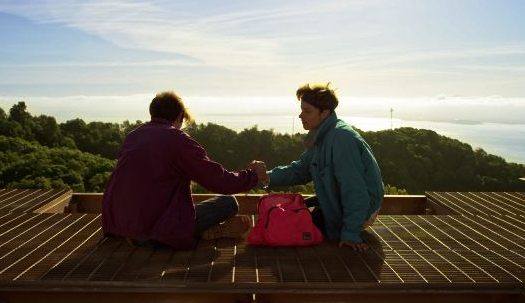 The two main characters meet together at the top of a space tower.