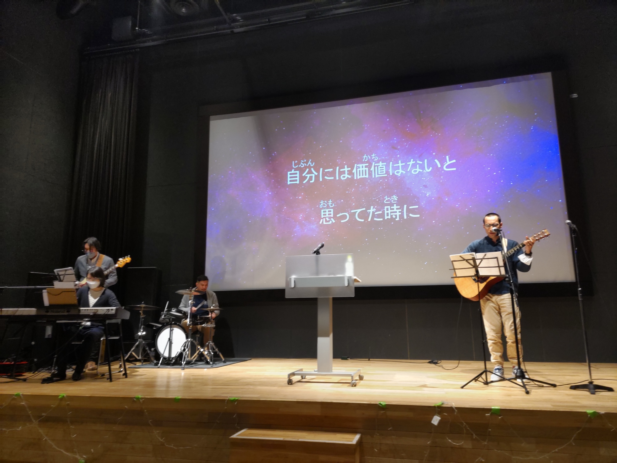 image shows Stephen leading worship