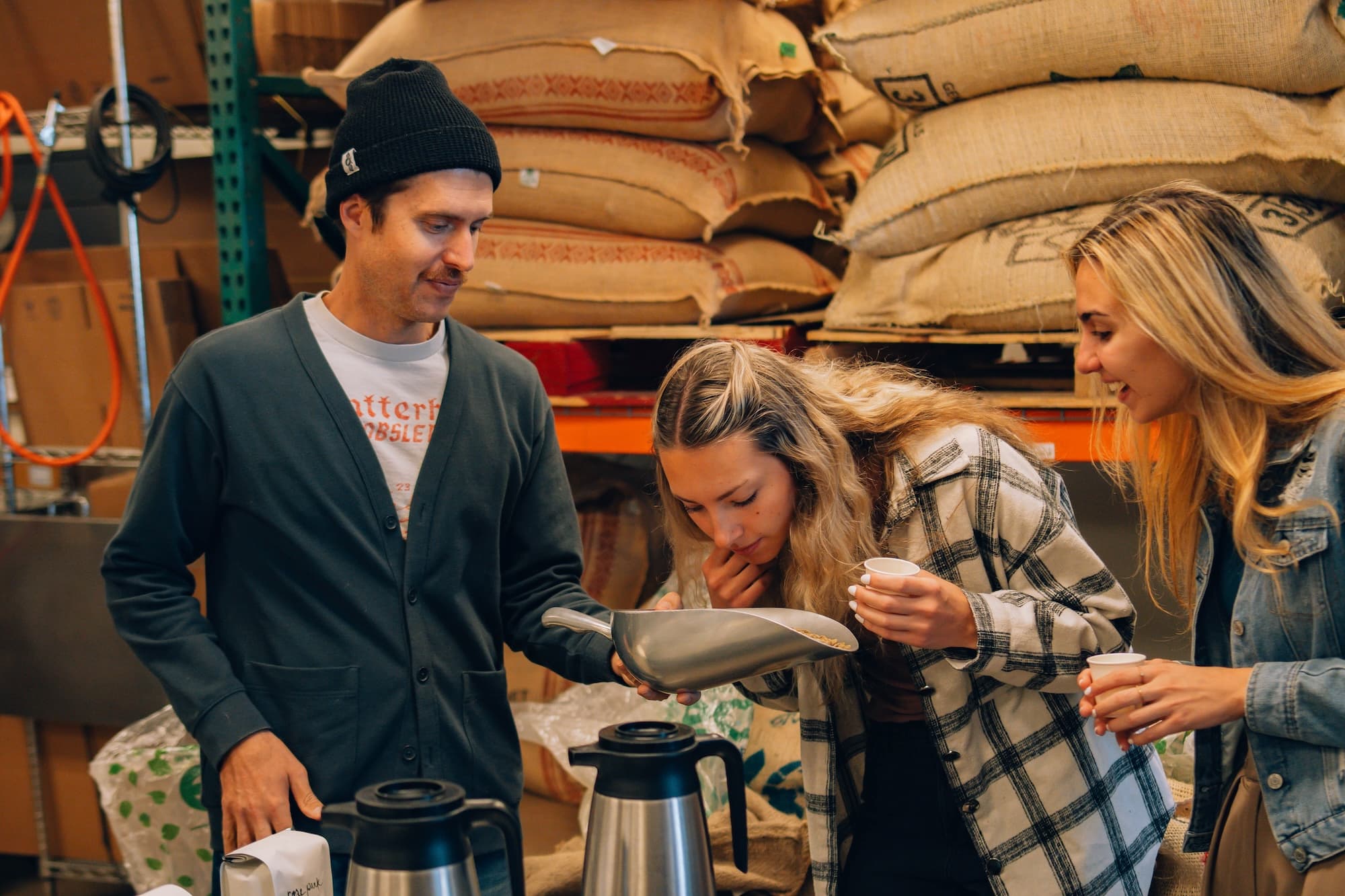 image shows student smelling coffee beans