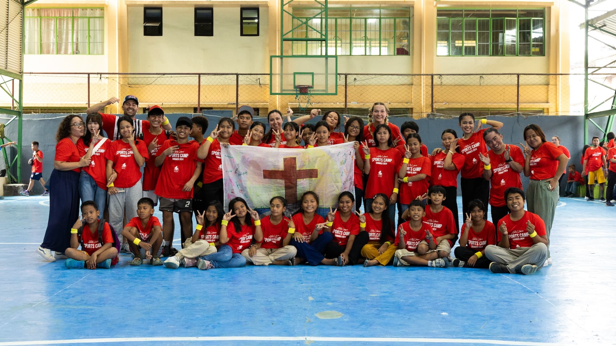 image shows children from the camp and some Biola team members