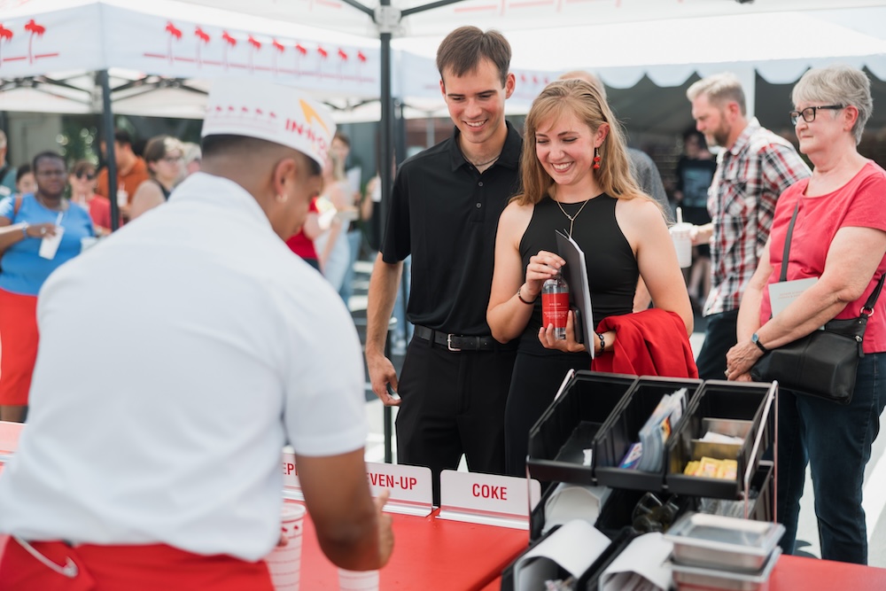 Image shows attendees getting In-N-Out lunch