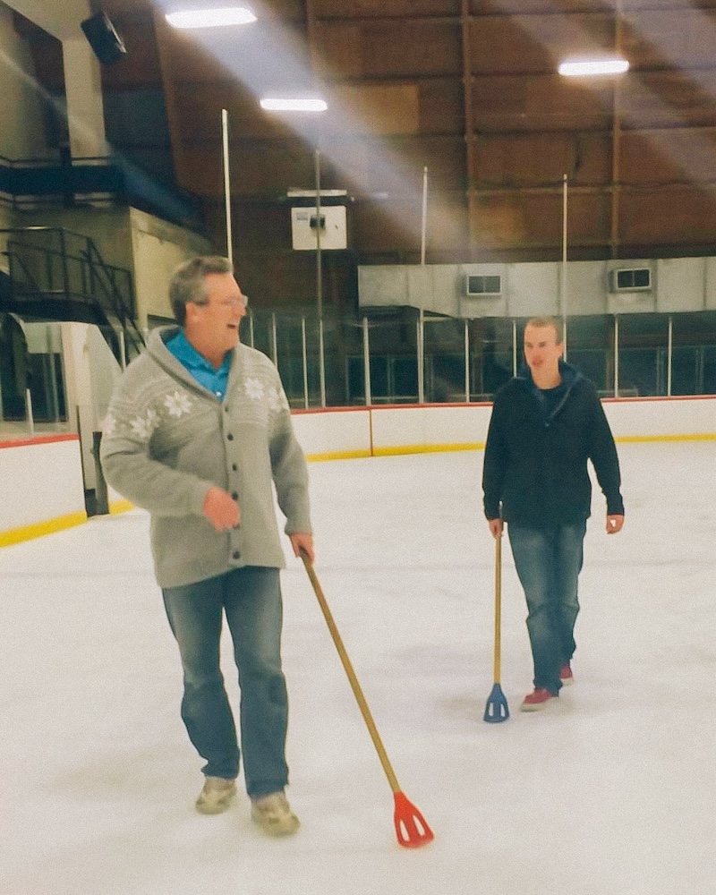 Image shows Phil Woodward playing broomball