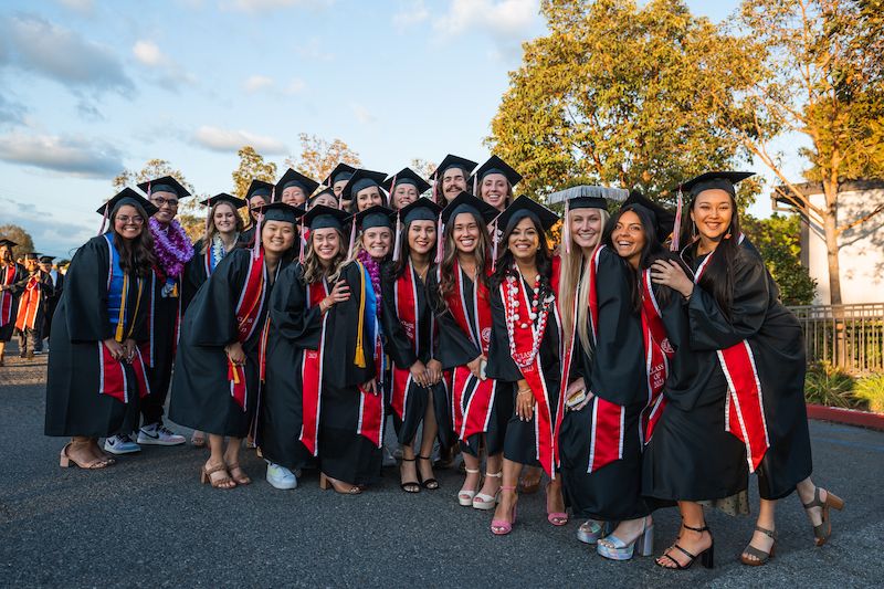 Image shows a group of graduates