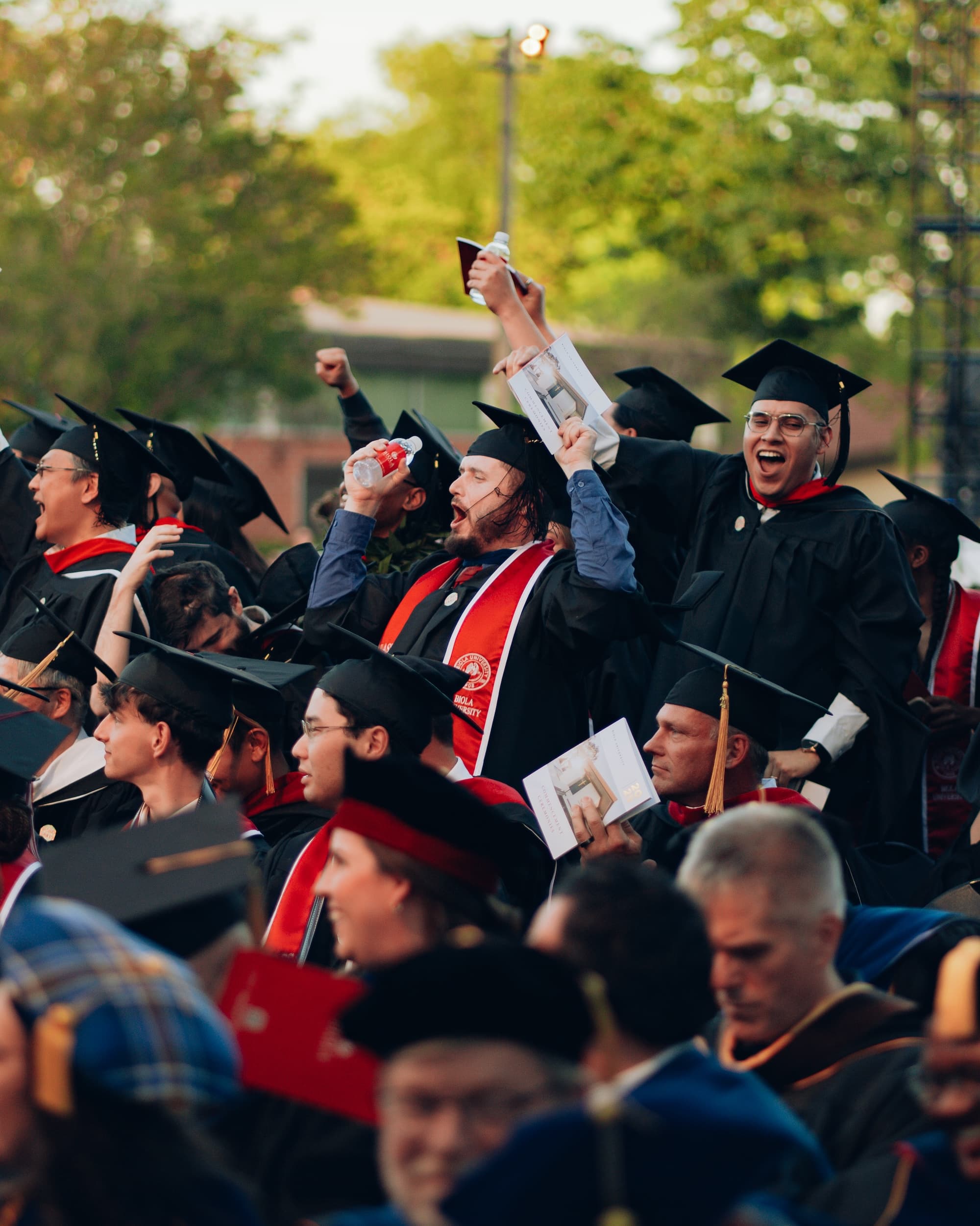 Image shows celebrating graduates