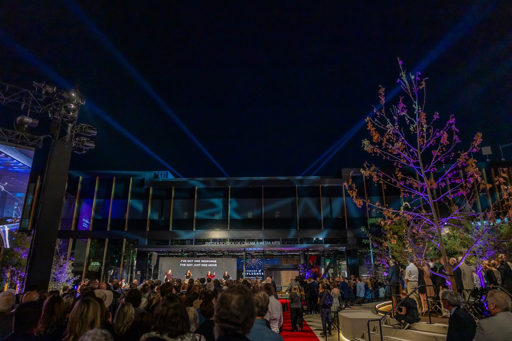 image shows guests in front of the building
