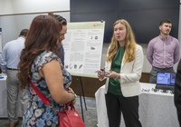 Student presenting poster