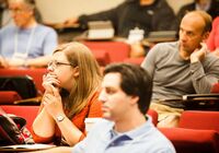 Audience listening to a speaker