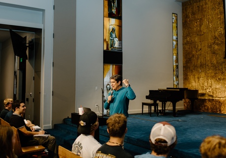 Chris Grace speaking in front of a crowd