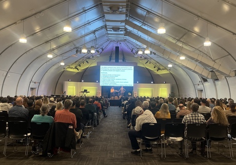 Chris and Alisa speaking at large marriage conference