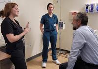 Dr. Barry Corey being assessed by students at the Health Fair