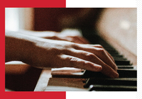 Hands playing piano keyboard