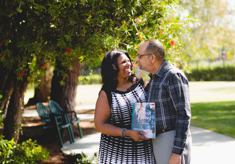 Married Couple Holding CMR Marriage Mentoring Workbook