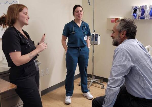 Dr. Barry Corey being assessed by students at the Health Fair