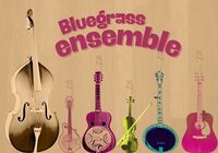 Guitar, banjo, fiddle on wooden background