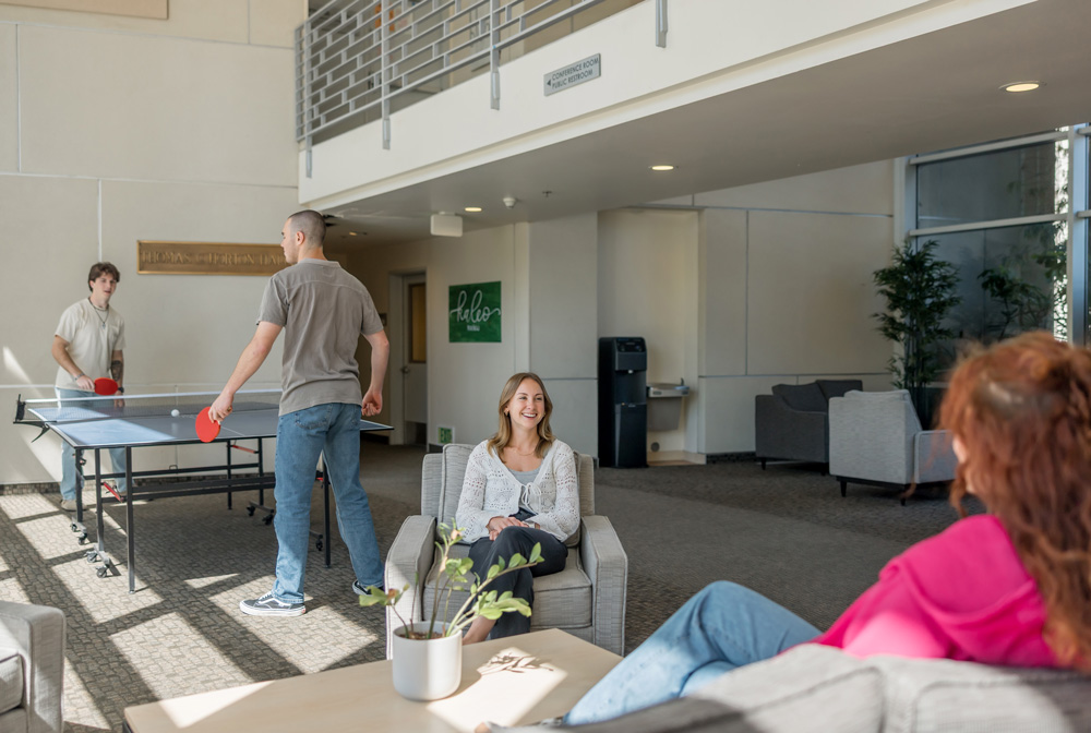 Students hanging out in a residence hall lounge