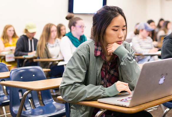 Female student studying in class