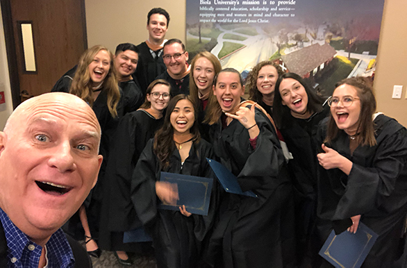 dean with a group of graduating students