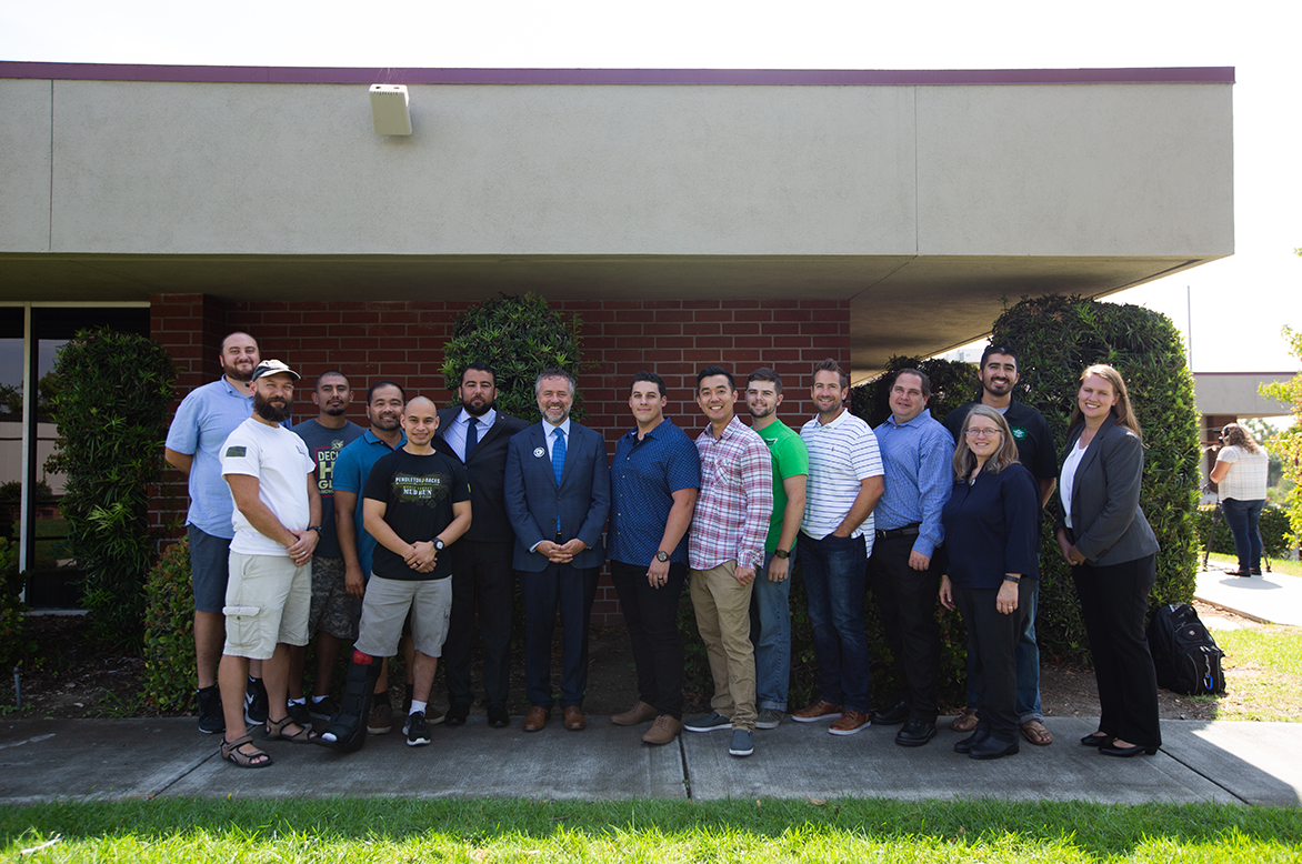 President Corey and group in front of Veterans Center.