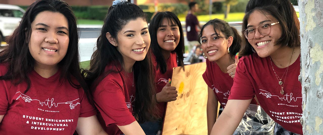 First-gen students posing at community event