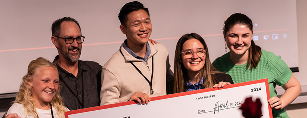 2024 startup competition winners posing with large check