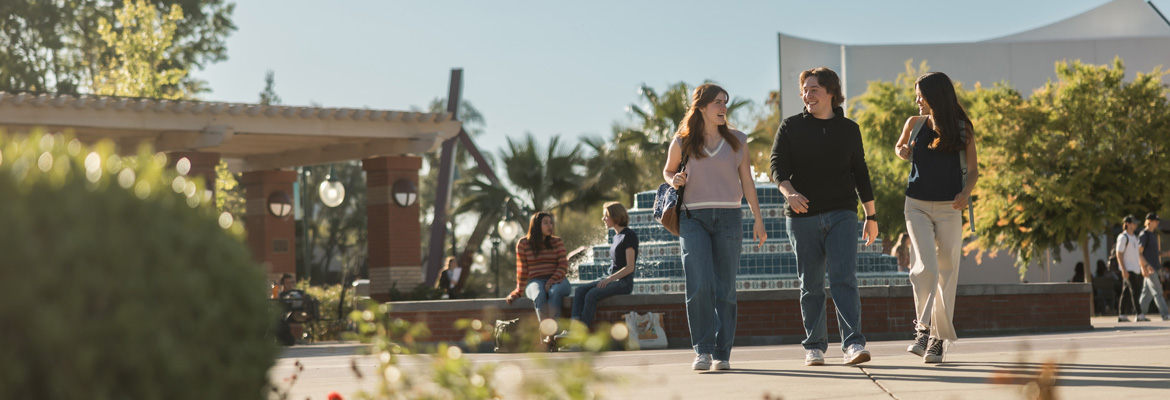 students walking by Fluor Fountain