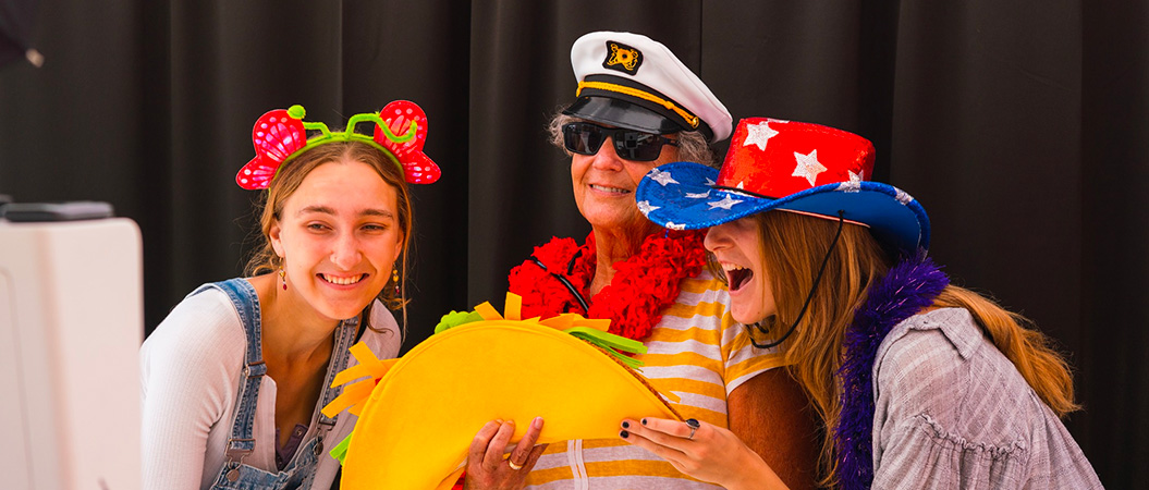 two female students posing with grandparent