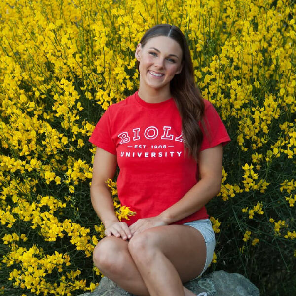 young woman wearing a Biola t-shirt