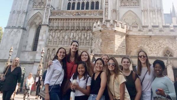 young people posing in front of Westminster Abbey