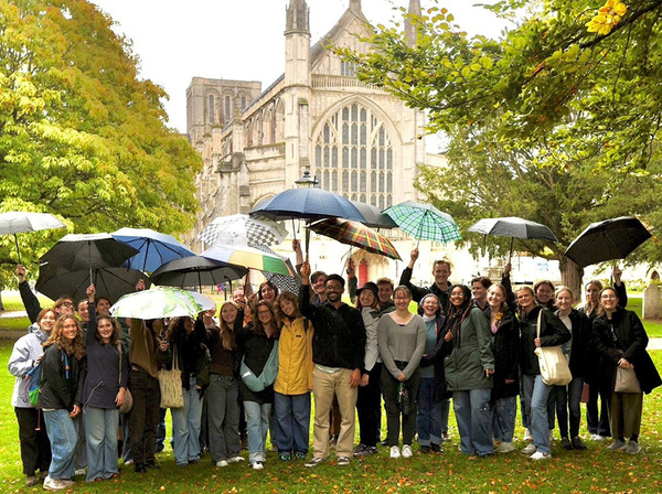 group photo under umbrella