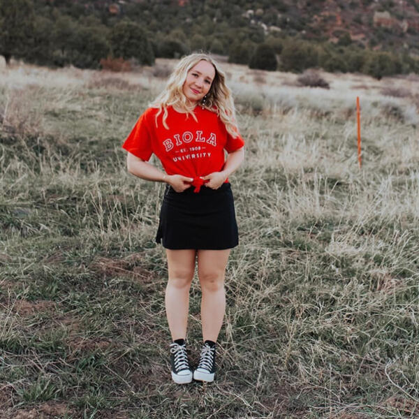young woman wearing a Biola t-shirt