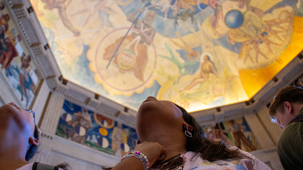 two students staring up on ceiling