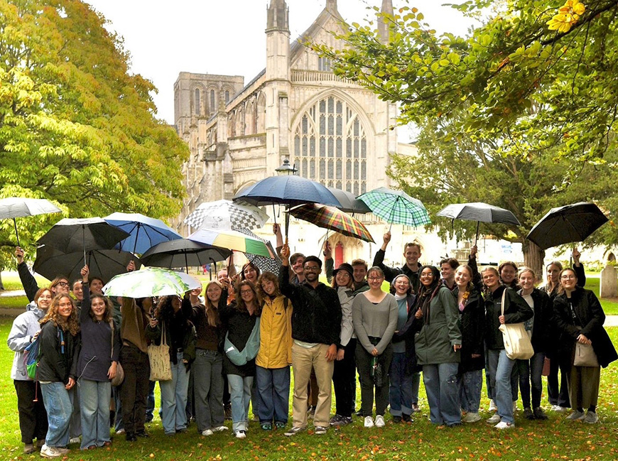 group photo under umbrella